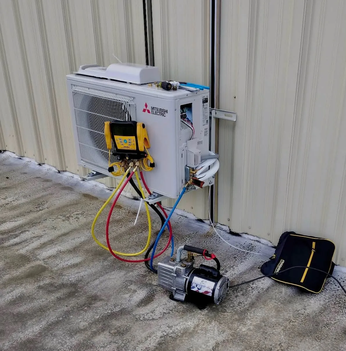 Technician testing a residential heat pump system